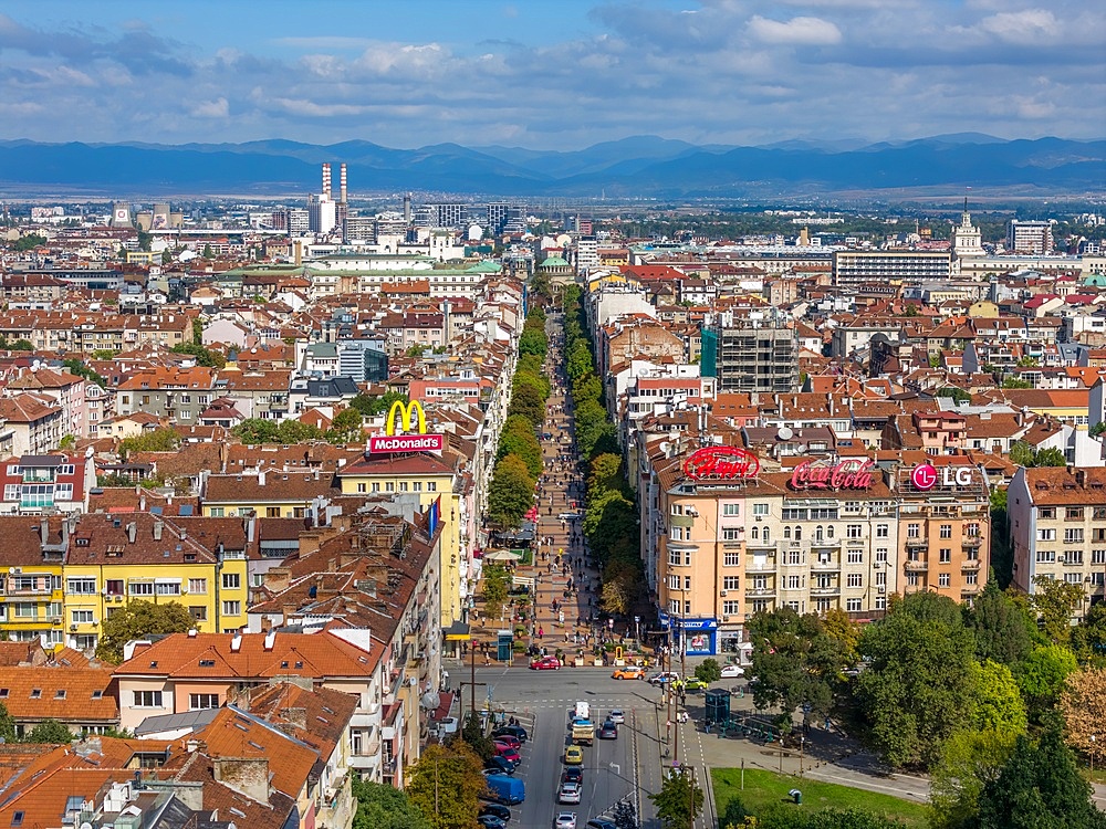 Aerial drone view of Vitosha Boulevard and neighbourhood in historic city centre of Sofia, Bulgaria. It is the main commercial street with stores, restaurants and bars