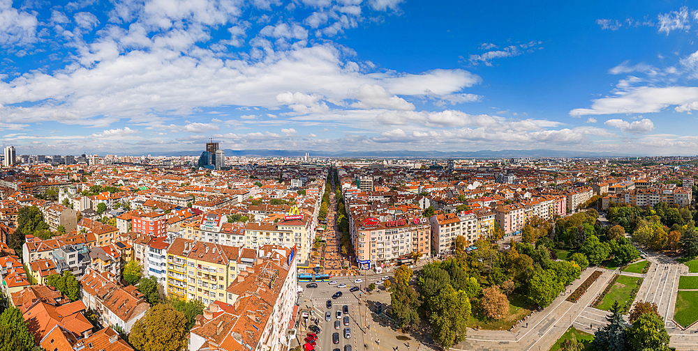 Aerial drone panoramic view of Vitosha Boulevard and neighbourhood in historic city centre of Sofia, Bulgaria. It is the main commercial street with stores, restaurants and bars