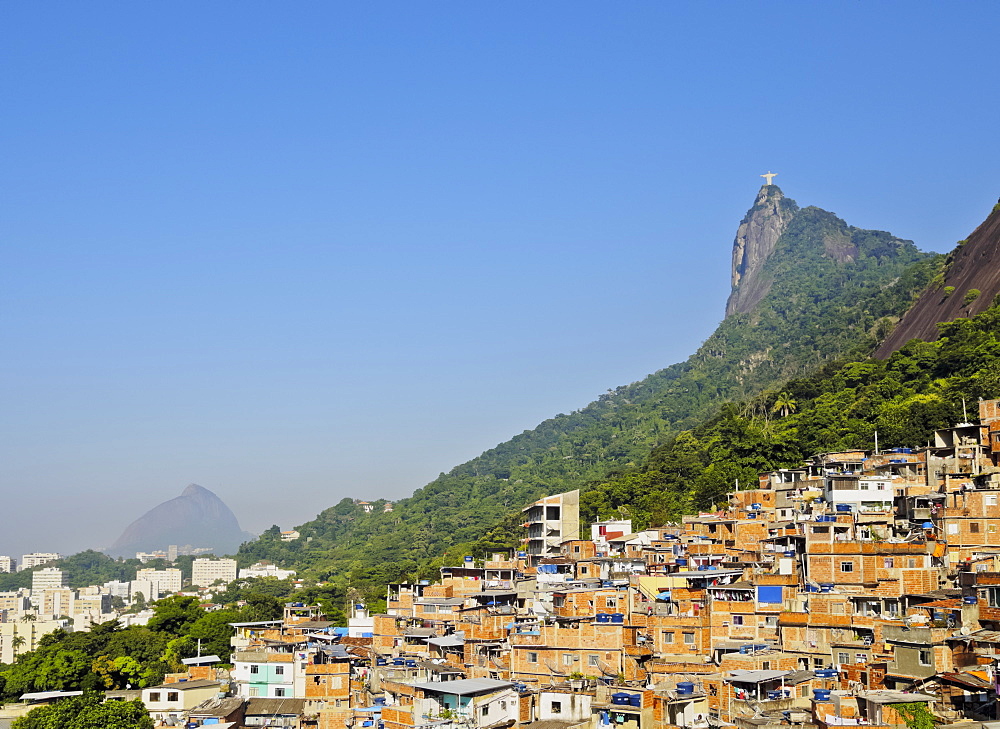 View of the Favela Santa Marta with Corcovado and the Christ statue behind, Rio de Janeiro, Brazil, South America