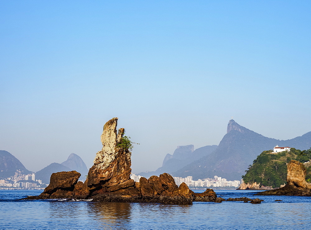 View over Icarai Rocks towards Boa Viagem Island, Corcovado Mountain and Pedra da Gavea, Niteroi, Rio de Janeiro State, Brazil, South America