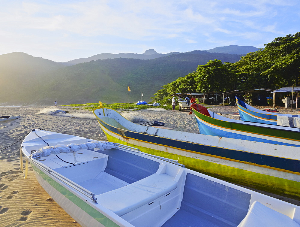 Traditional colourful boats on the beach in Bonete, Ilhabela Island, State of Sao Paulo, Brazil, South America