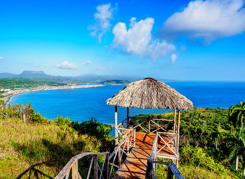 View over Bahia de Miel towards city and El Yunque Mountain, Baracoa, Guantanamo Province, Cuba, West Indies, Caribbean, Central America