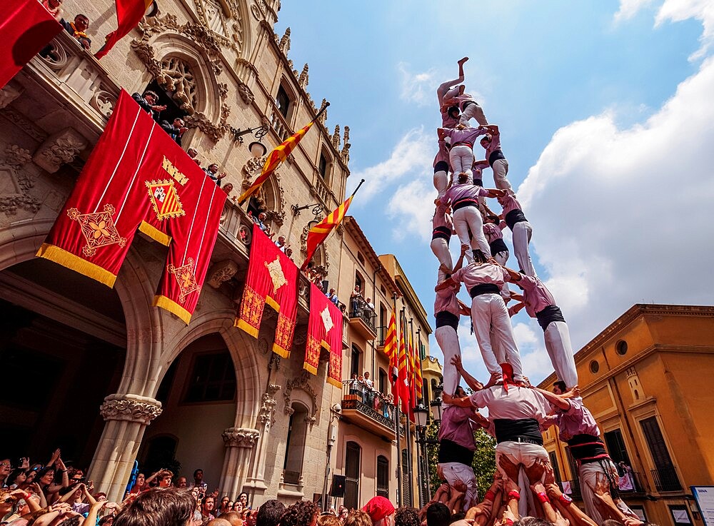 Castell human tower in front of the City Hall during the Festa Major Festival, Terrassa, Catalonia, Spain, Europe