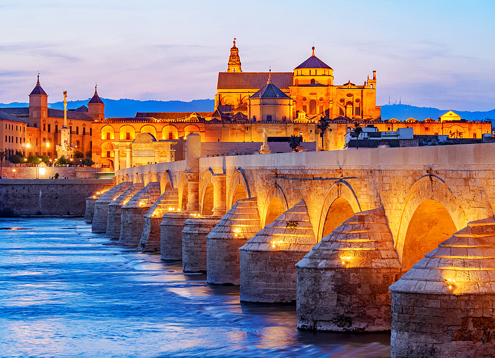 View over Roman Bridge of Cordoba and Guadalquivir River towards the Mosque Cathedral, dusk, UNESCO World Heritage Site, Cordoba, Andalusia, Spain, Europe