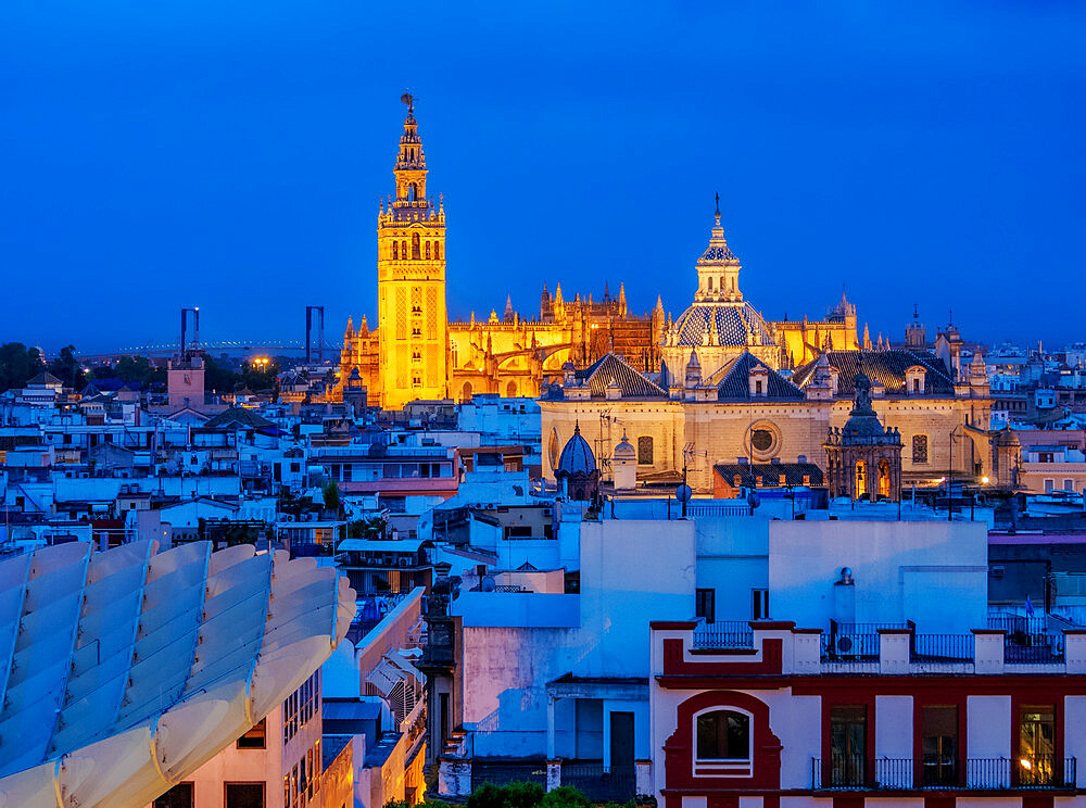 View from Metropol Parasol towards The Church of the Divine Savior and The Cathedral at dusk, Seville, Andalusia, Spain, Europe