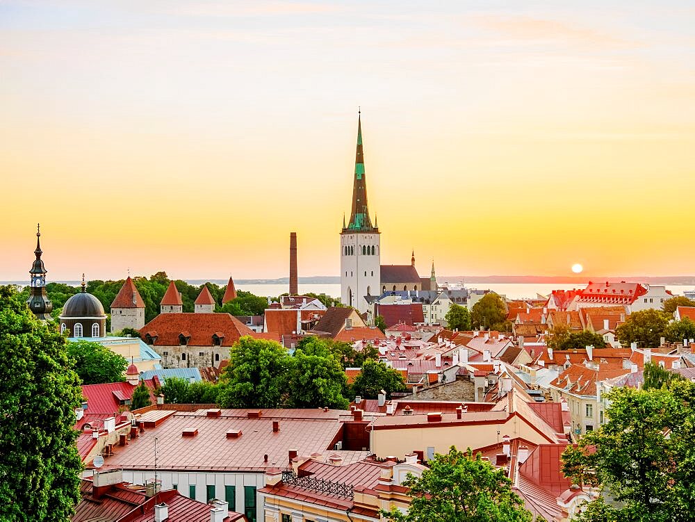 View over the Old Town towards St Olaf's Church at sunrise, Tallinn, Estonia