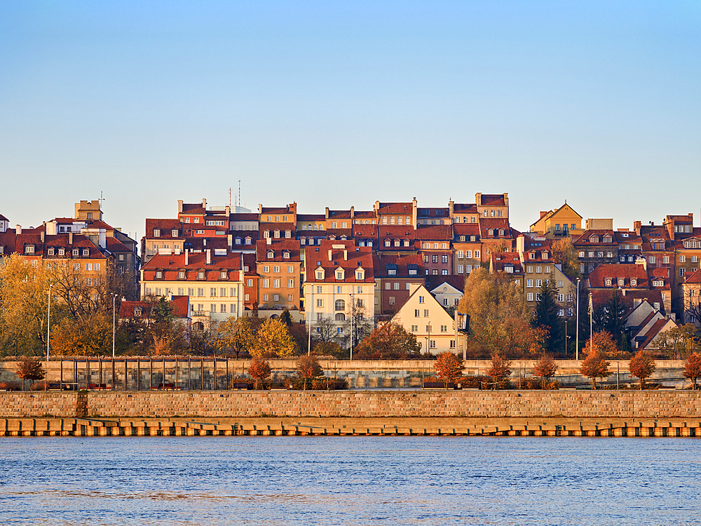 View over River Vistula towards The Old Town at sunrise, Warsaw, Masovian Voivodeship, Poland, Europe