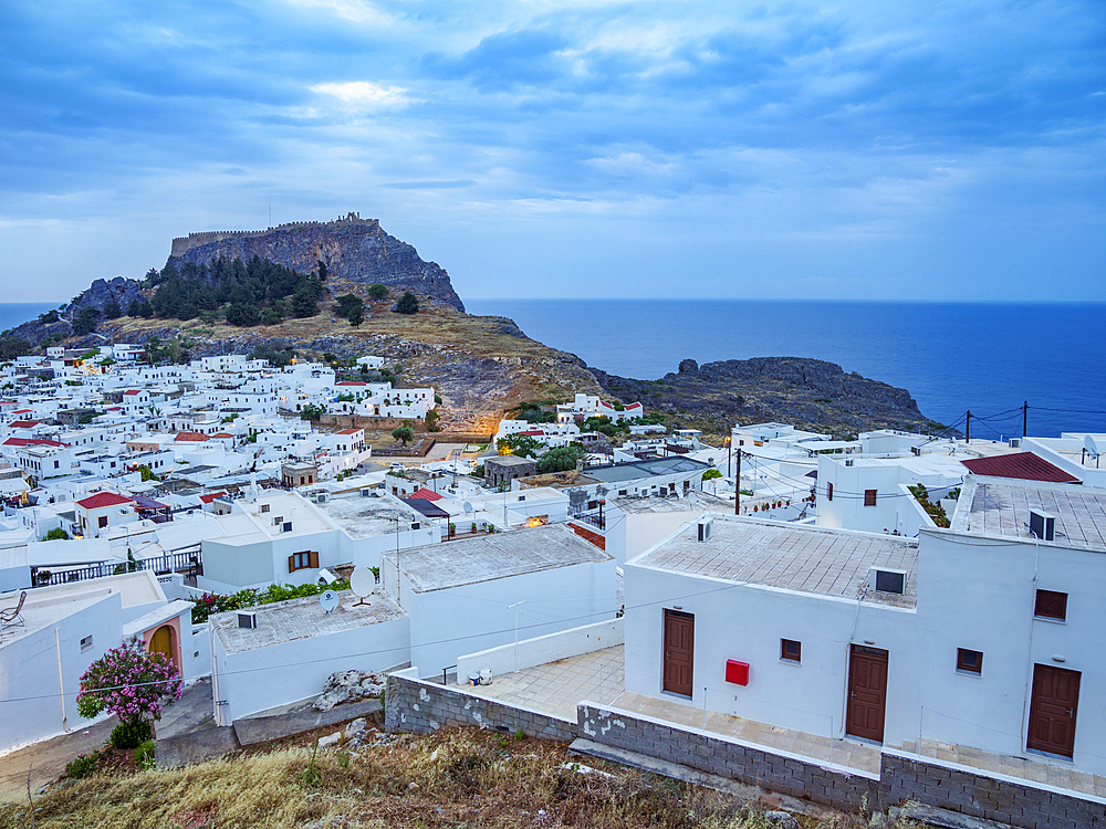 View over Lindos village towards the Acropolis, Rhodes Island, Dodecanese, Greek Islands, Greece, Europe