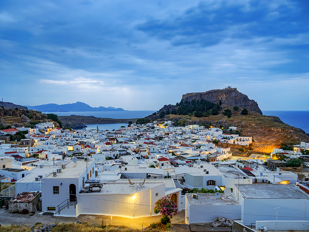 View over Lindos village towards the Acropolis at dawn, Rhodes Island, Dodecanese, Greek Islands, Greece, Europe