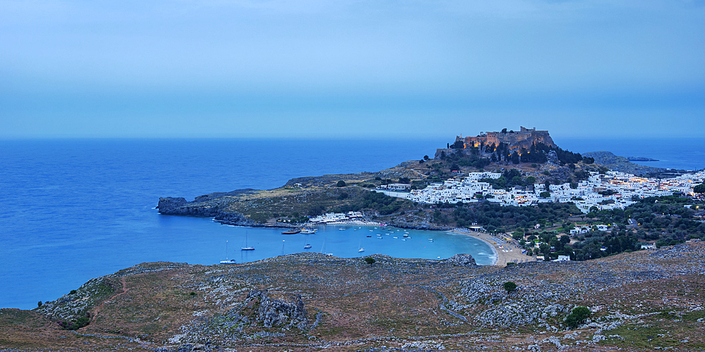 View towards the Acropolis of Lindos at dusk, Rhodes Island, Dodecanese, Greek Islands, Greece, Europe