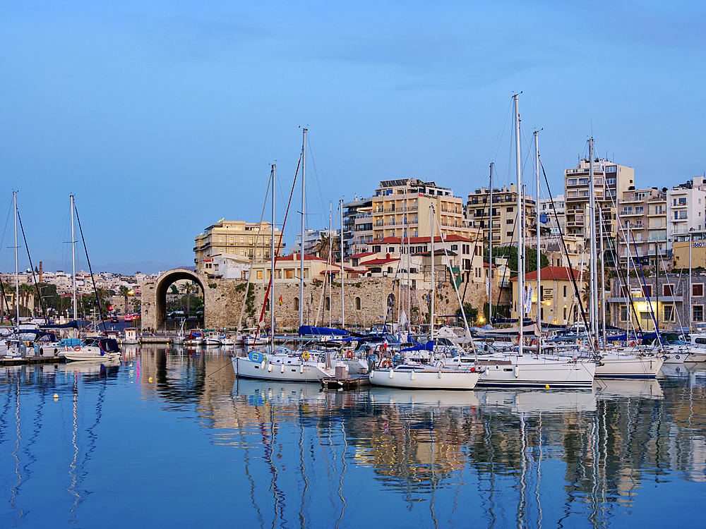 Venetian Dockyards at the Old Port at dusk, City of Heraklion, Crete, Greek Islands, Greece, Europe