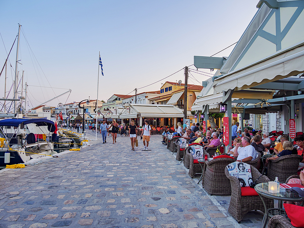 Restaurants at the waterfront at dusk, Port of Pythagoreio, Samos Island, North Aegean, Greek Islands, Greece, Europe