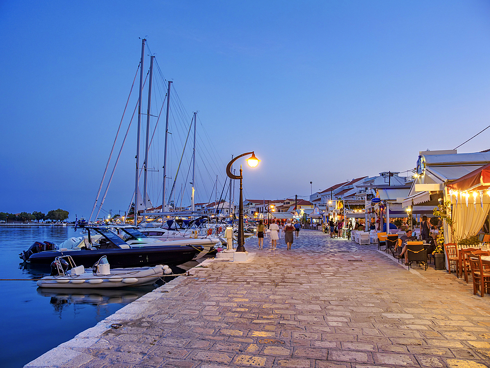 Restaurants at the waterfront at dusk, Port of Pythagoreio, Samos Island, North Aegean, Greek Islands, Greece, Europe