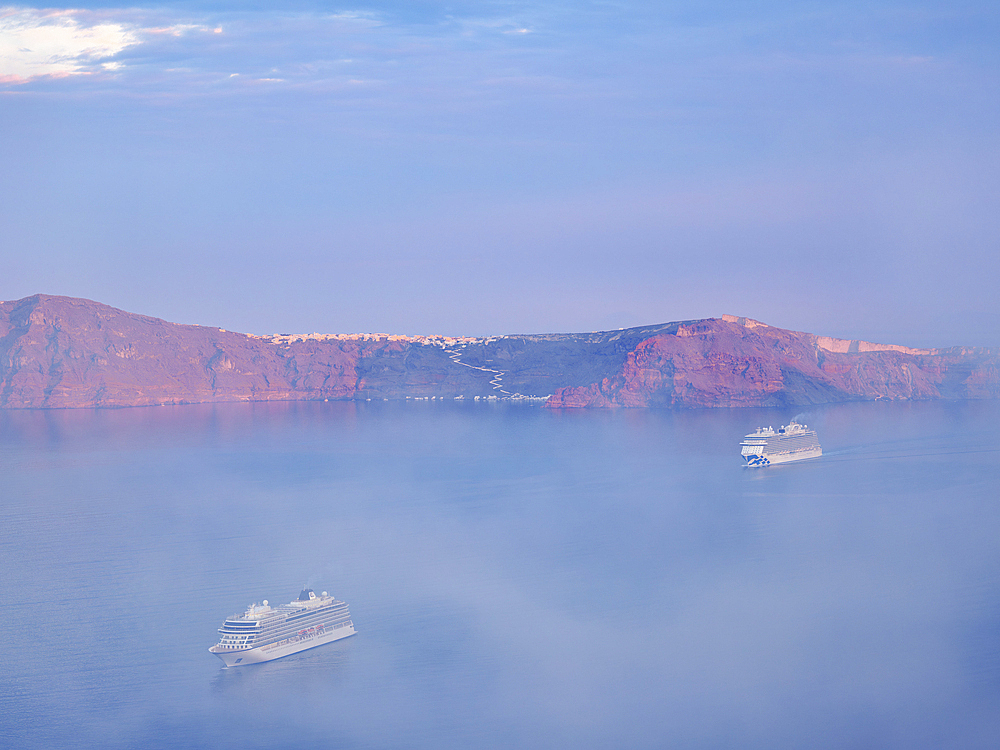 Caldera at foggy sunrise seen from Fira, Santorini (Thira) Island, Cyclades, Greek Islands, Greece, Europe