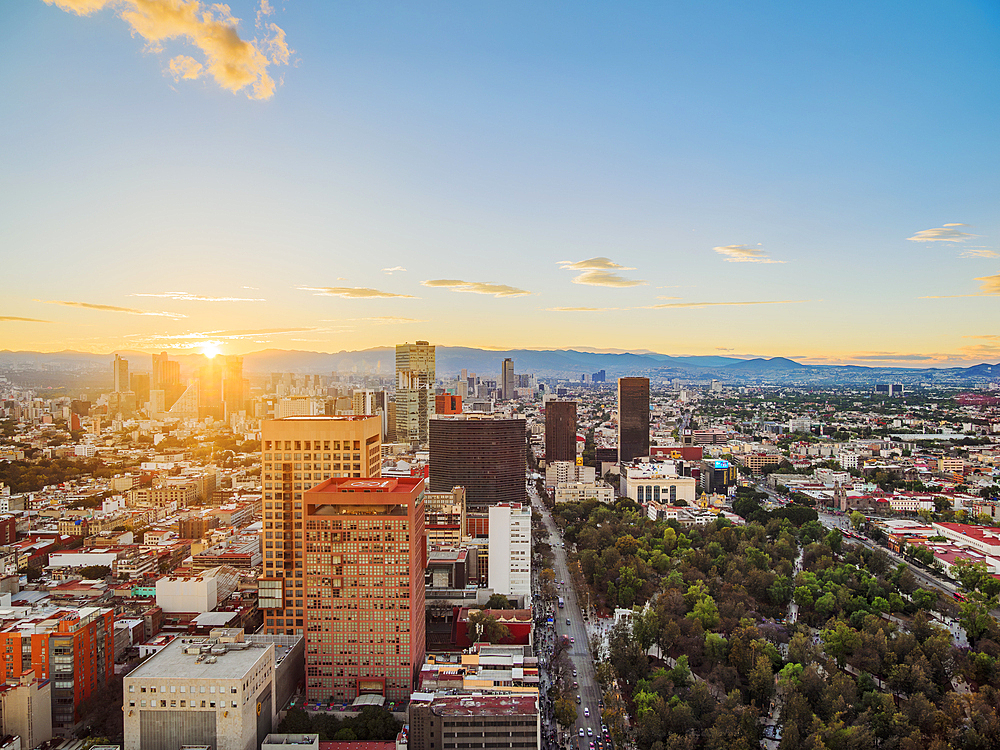 View over Alameda Central towards High-rise buildings of Paseo de la Reforma at sunset, Mexico City, Mexico