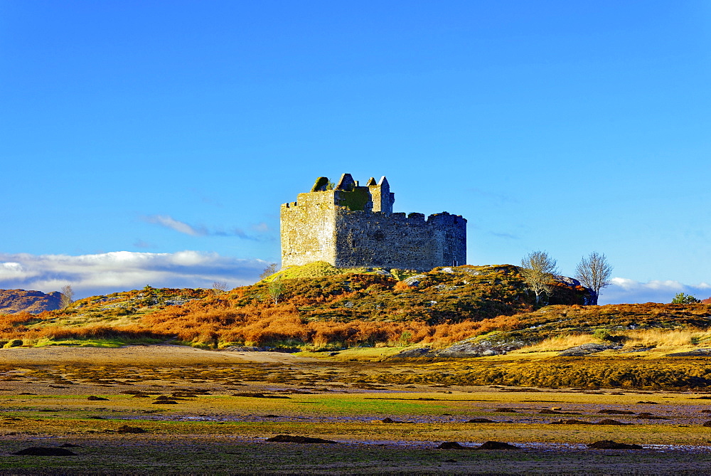 Castle Tioram on the coastal island Eilean Tioram where River Shiel and Loch Moidart meet, at low tide on a sunny winter morning, Highlands, Scotland, United Kingdom, Europe