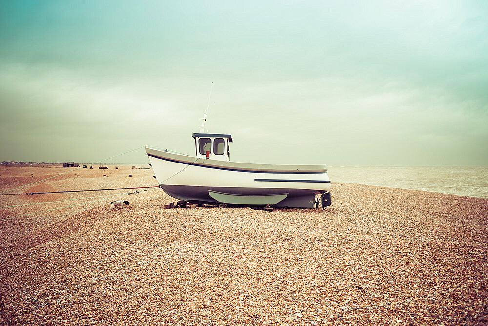 Fishing boats on the shingle beach waiting to go back out to the water, Dungeness, Kent, England, United Kingdom, Europe