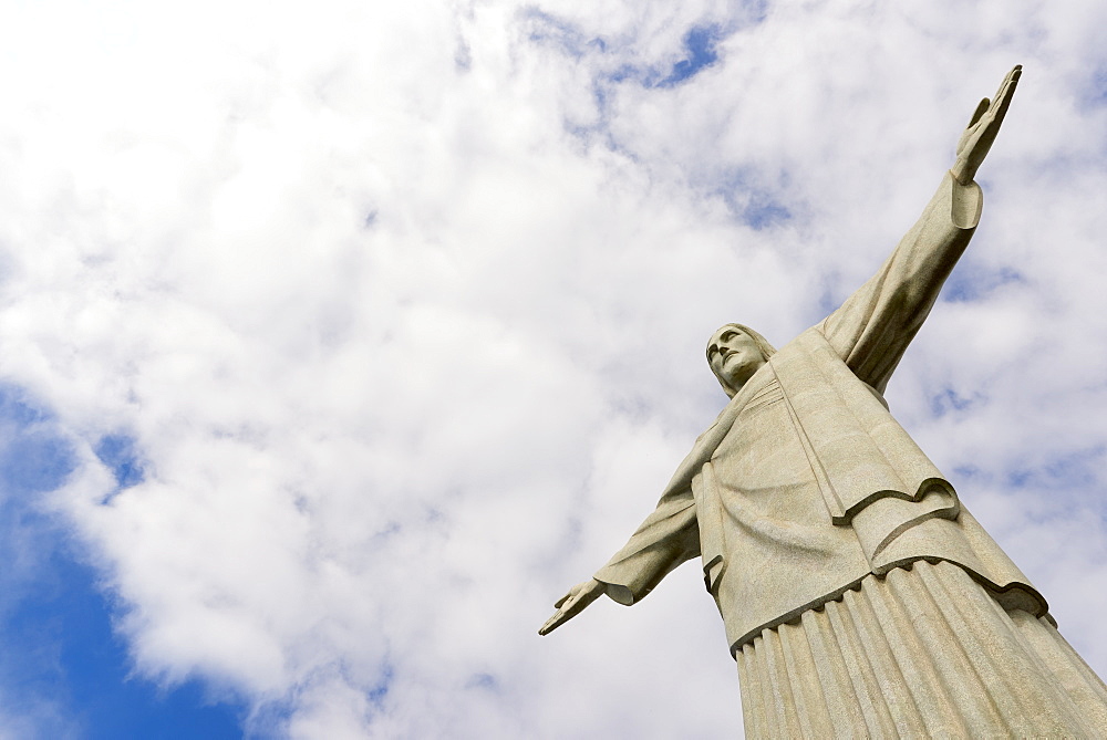 Low angle cropped shot of the iconic statue of Christ the Redeemer on a cloudy day, Rio de Janeiro, Brazil, South America