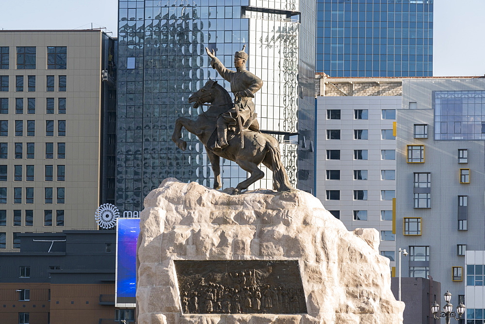 Damdin Sukhbaatar statue with skyscrapers in the background, Ulan Bator, Mongolia, Central Asia, Asia