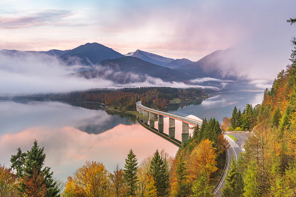 Sylvenstein Lake and bridge surrounded by the morning mist at dawn, Bad Tolz-Wolfratshausen district, Bavaria, Germany, Europe