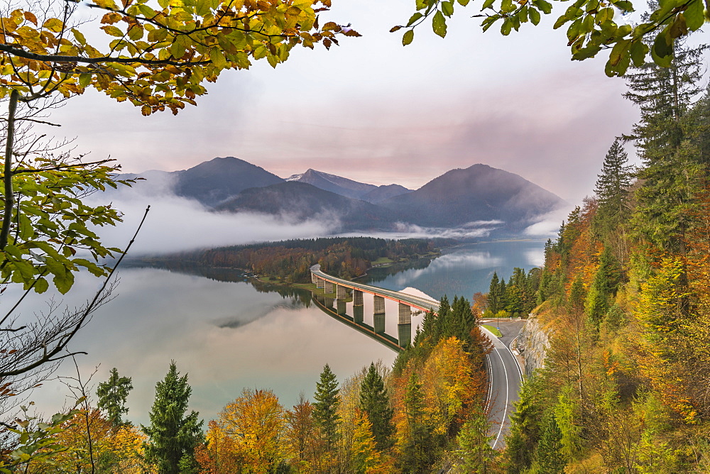 Sylvenstein Lake and bridge surrounded by the morning mist at dawn, Bad Tolz-Wolfratshausen district, Bavaria, Germany, Europe