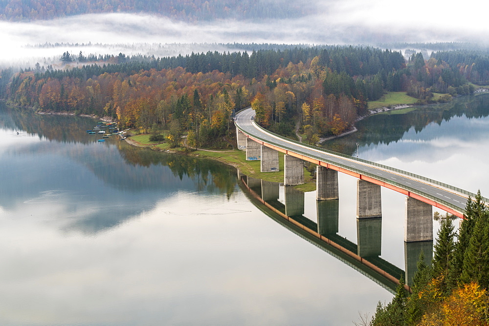 Sylvenstein Lake and bridge surrounded by the morning mist, Bad Tolz-Wolfratshausen district, Bavaria, Germany, Europe