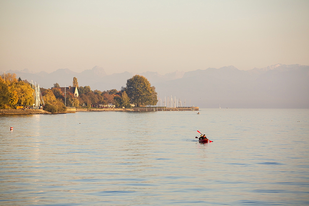 Canoeing on Lake Constance at sunset, Meersburg, Baden-Wurttemberg, Germany, Europe