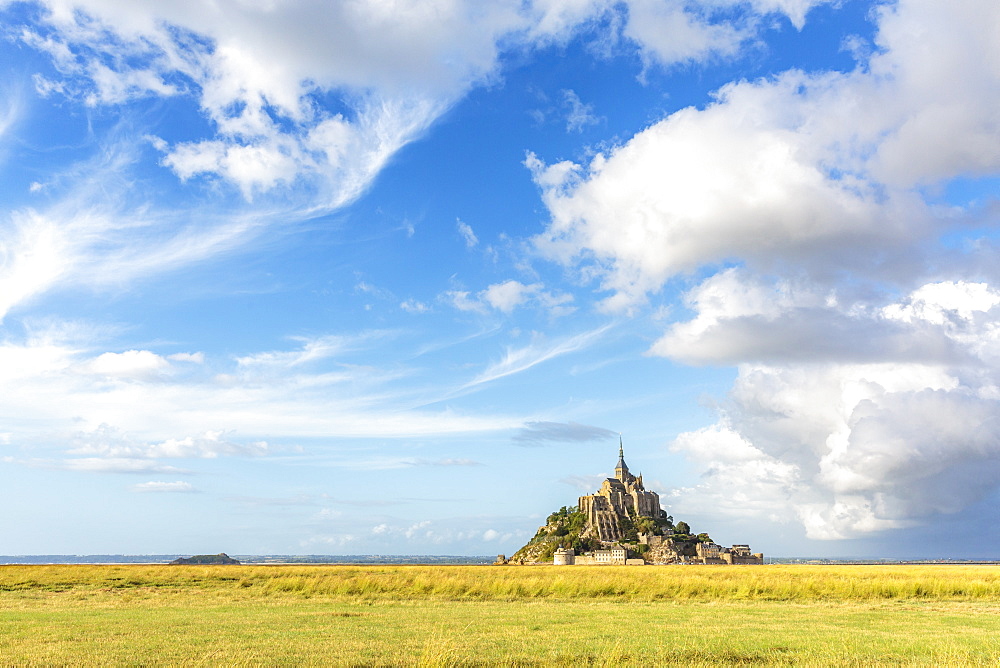 Clouds in the sky and grass in the foreground, Mont-Saint-Michel, UNESCO World Heritage Site, Normandy, France, Europe