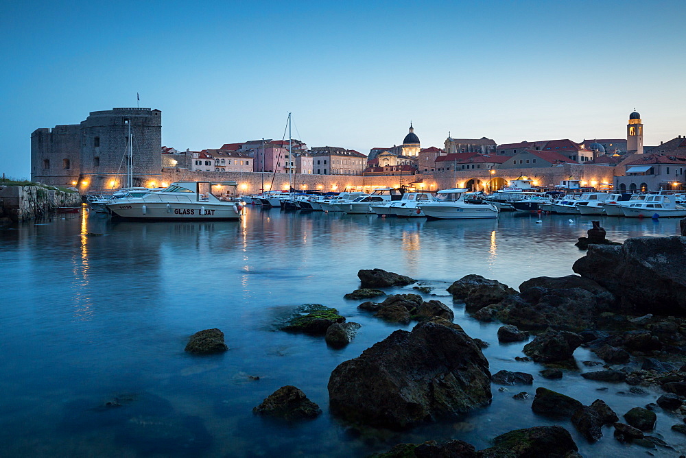 The lights of old town Dubrovnik and its harbour during blue hour, Dubrovnik, Croatia, Europe