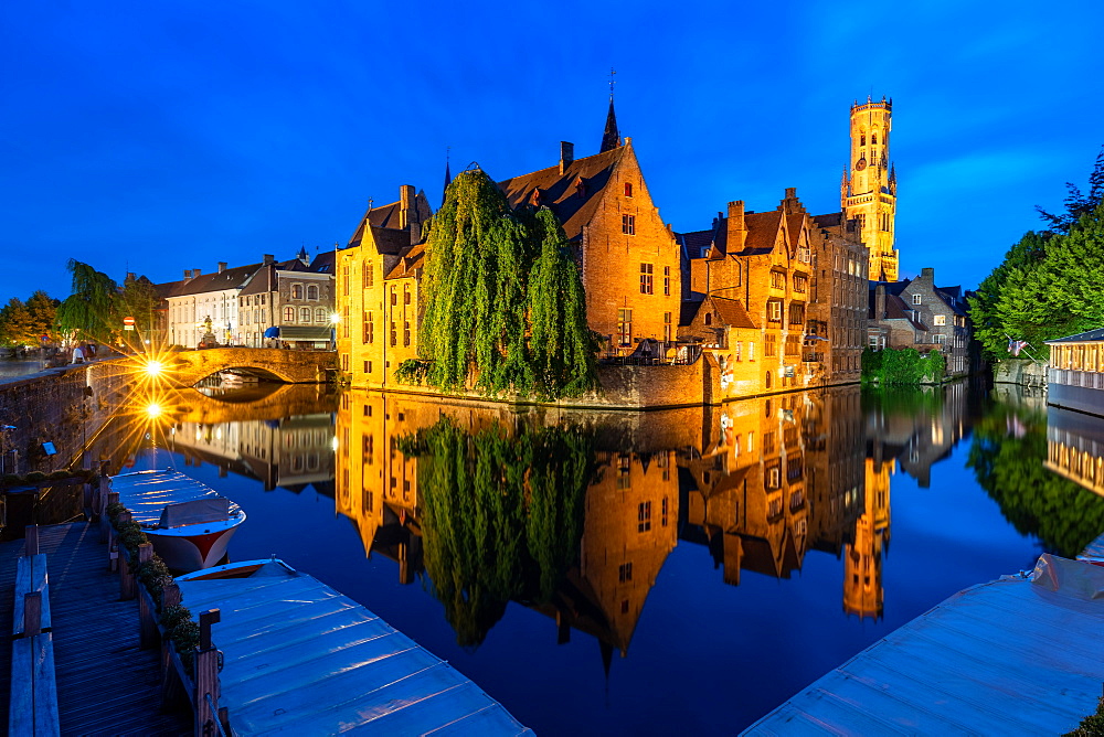 The beautiful buildings of Bruges reflected in the still waters of the canal, UNESCO World Heritage Site, Bruges, Belgium, Europe