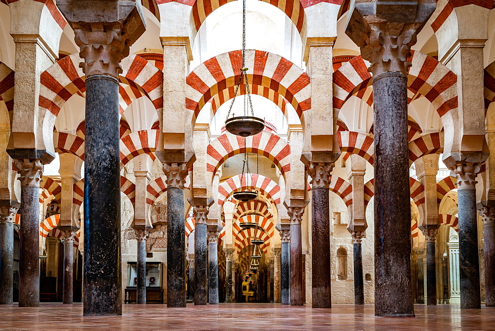 The red and white stone Arches of Mezquita de Cordoba (Great Mosque) (Cordoba Cathedral), UNESCO World Heritage Site, Cordoba, Andalusia, Spain, Europe