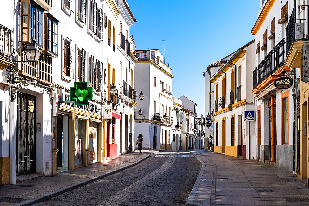 The white and yellow buildings of a typical Andalusian street in Cordoba, Andalusia, Spain, Europe