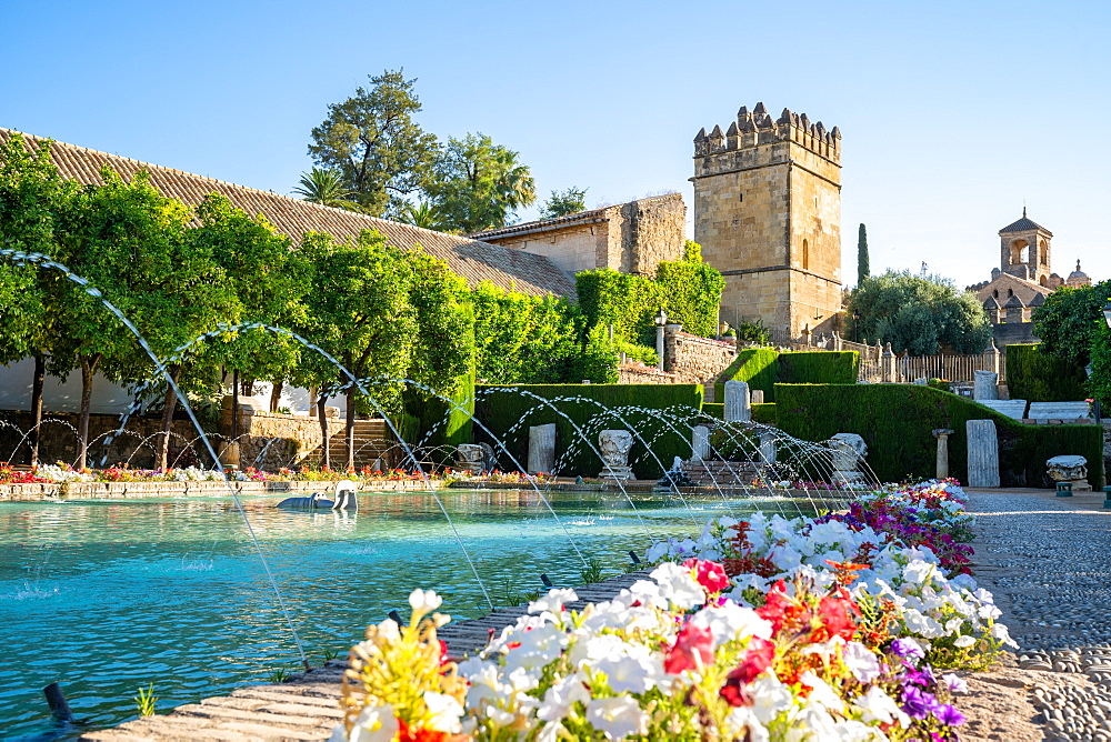 Lion Tower and a pond with fountains in the gardens of the Alcazar de Los Reyes Cristianos, UNESCO World Heritage Site, Cordoba, Andalusia, Spain, Europe