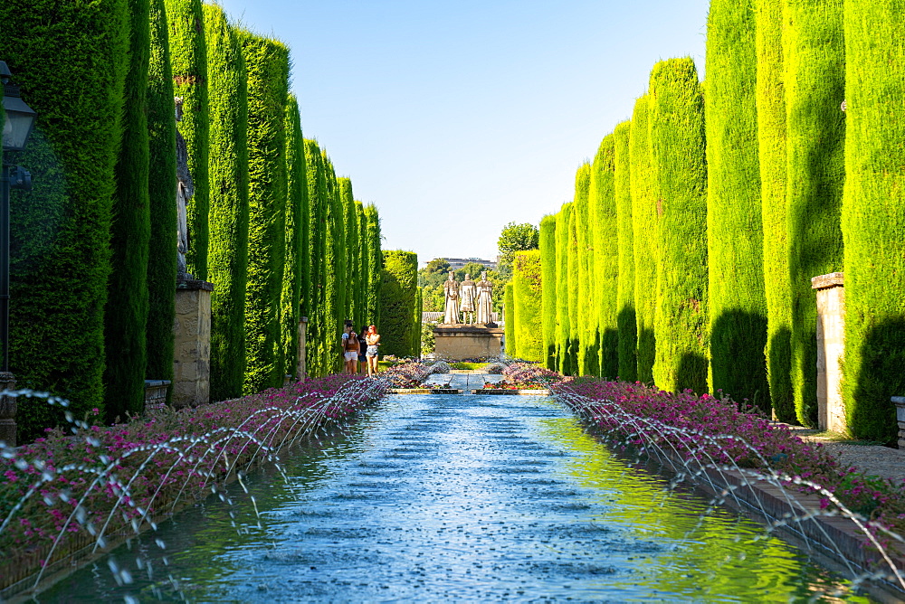 Cypress trees, statues and fountains in the gardens of the Alcazar de Los Reyes Cristianos, UNESCO World Heritage Site, Cordoba, Andalusia, Spain, Europe