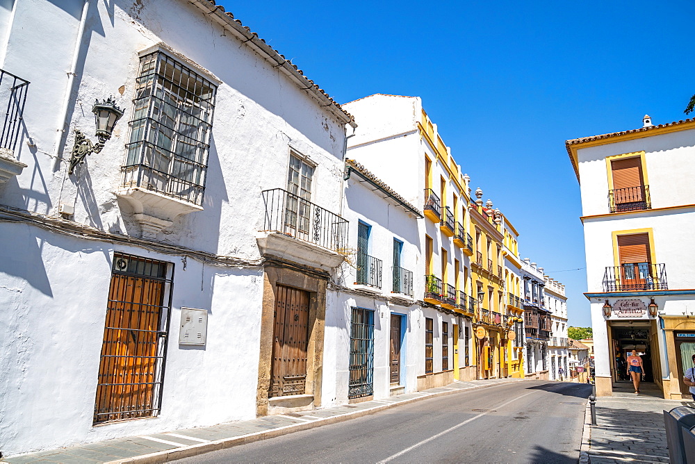 Typical white stone buildings of Andalusia, trimmed with yellow, Ronda, Andalusia, Spain, Europe