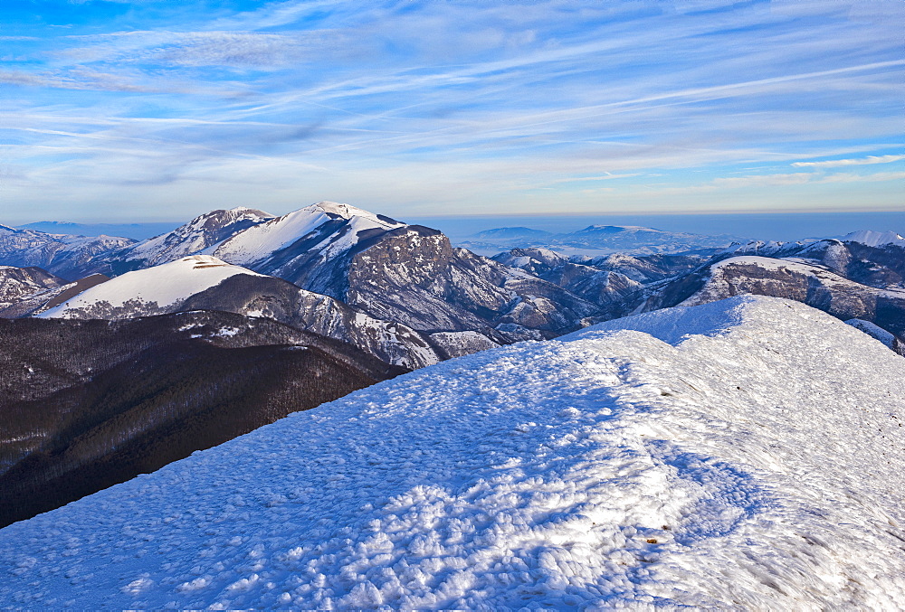 Sunrise on Mountain Catria from the summit of Cucco in winter, Apennines, Umbria, Italy, Europe