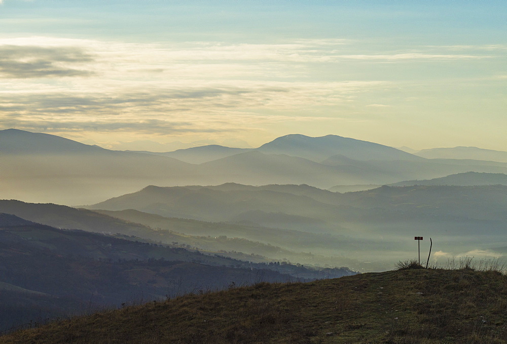 Sunrise on Apennines on a winter day with fog, Gubbio, Umbria, Italy, Europe