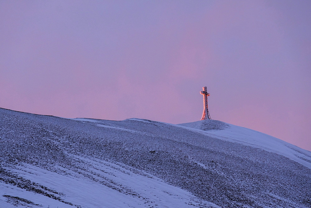 Summit cross of Monte Catria at sunrise in winter, Apennines, Umbria, Italy, Europe