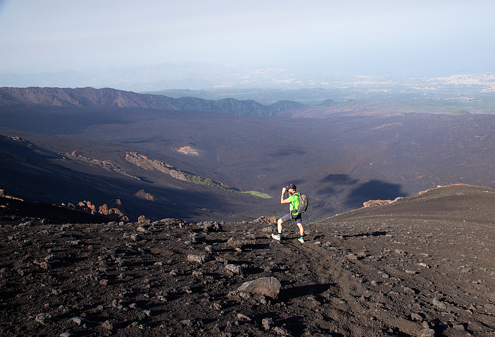 hiker trekking on mount Etna