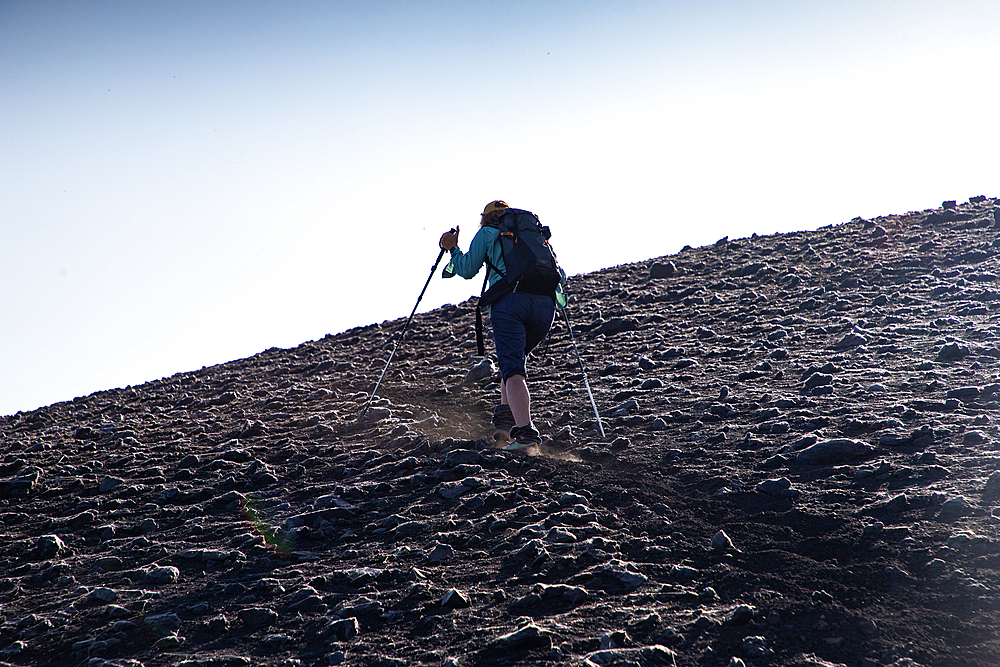 hiker trekking on mount Etna