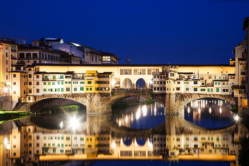 Ponte Vecchio at night reflecting in River Arno, Florence, UNESCO World Heritage Site, Tuscany, Italy, Europe