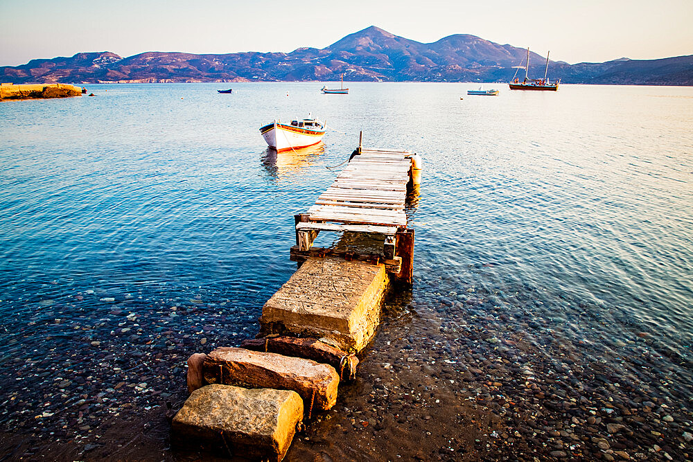 Pier and fishing boat, Milos, Cyclades, Greek Islands, Greece, Europe