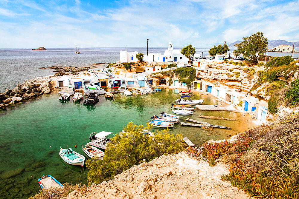 View over fishing harbour with boats and colourful boat houses, Mandrakia, Milos, Cyclades, Aegean Sea, Greek Islands, Greece, Europe