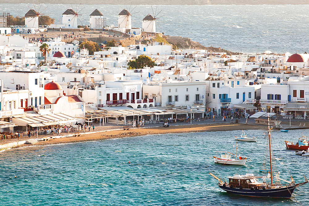 Waterfront and windmills on hill behind on the beautiful island of Mykonos, Cyclades, Greek Islands, Greece, Europe