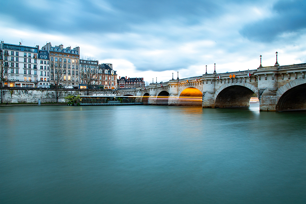 bridge Pont Neuf and Seine river with old houses, Paris, France, toned