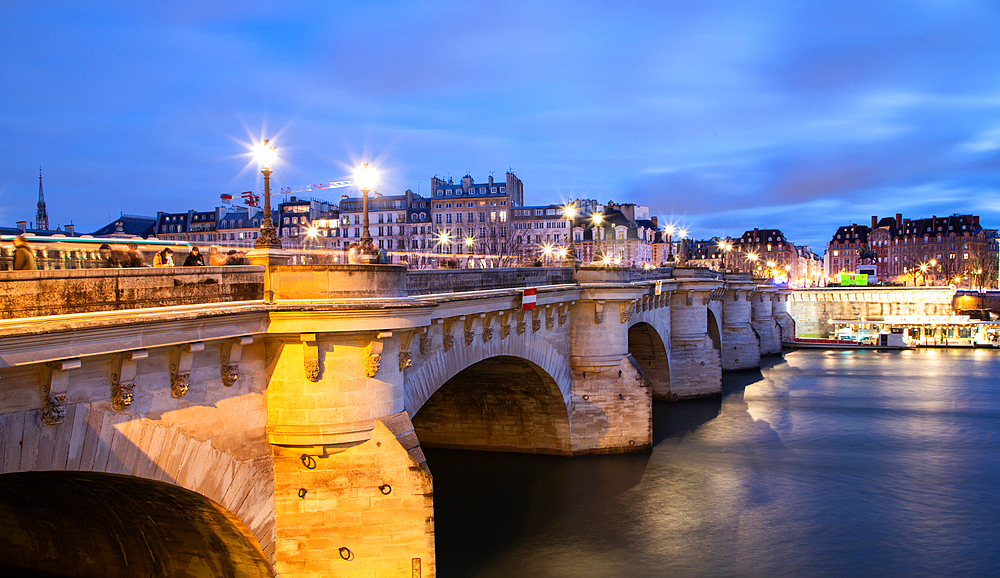 bridge Pont Neuf and Seine river with old houses, Paris, France, toned