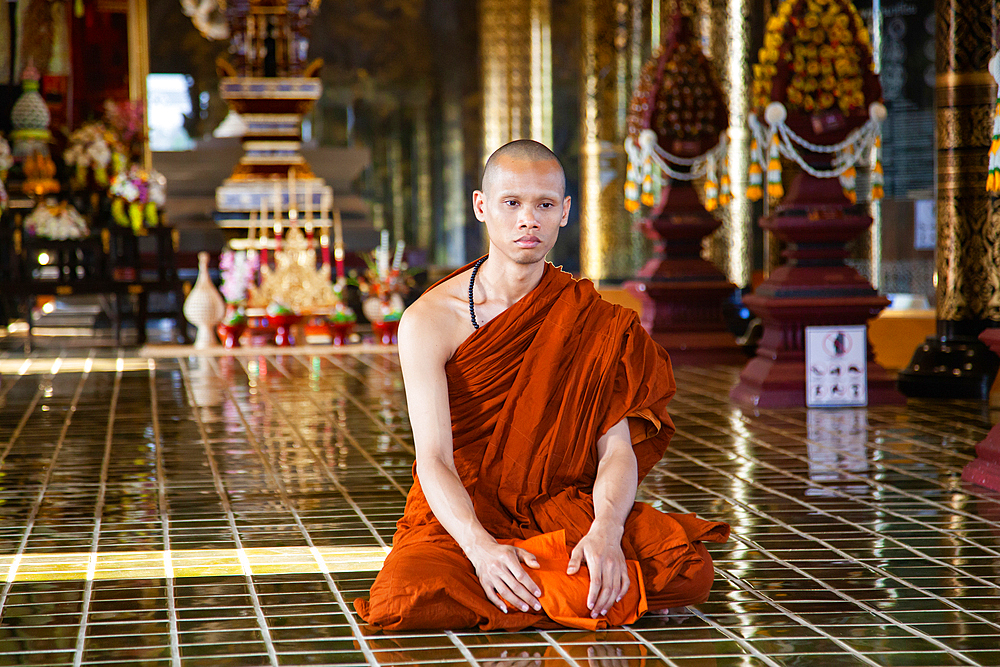 Buddhist monk performing daily duties in Chiangmai,Thailand