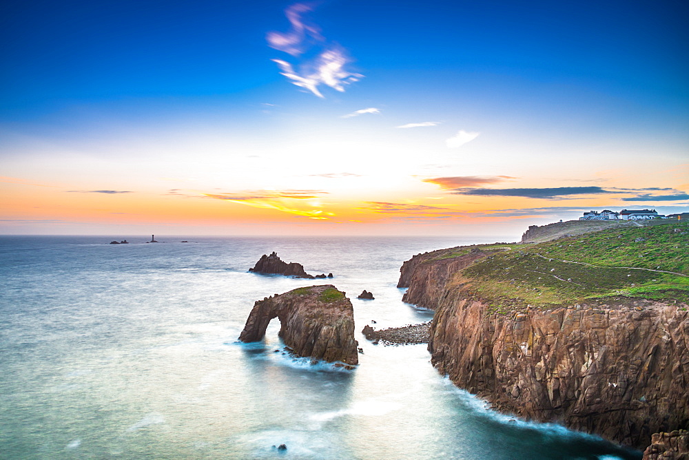 Dramatic sky at sunset with Enys Dodnan and the Armed Knight rock formations at Lands End, Cornwall, England, United Kingdom, Europe