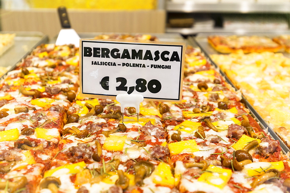 Pizza in a bakery of Old Town, Bergamo, Province of Bergamo, Lombardy, Italy, Europe