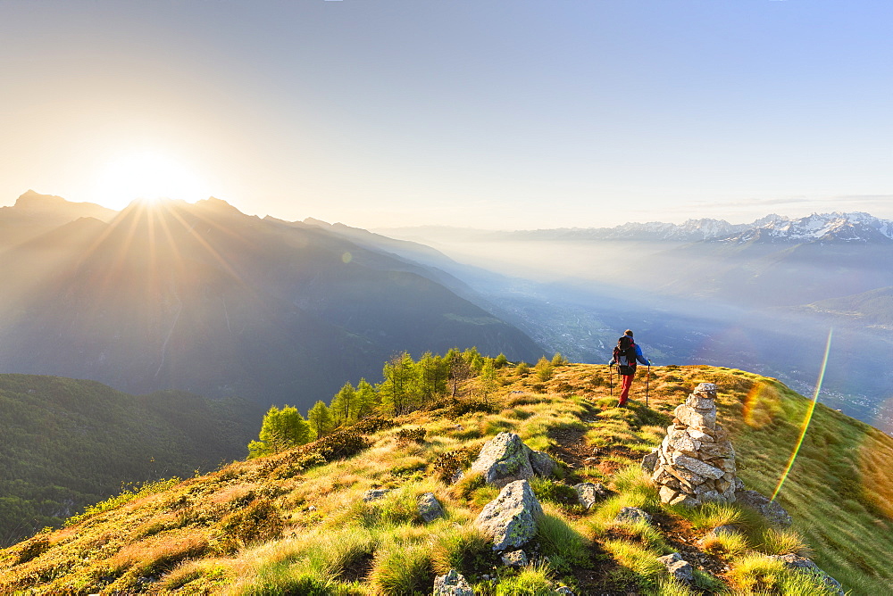 A hiker on the ridge of Mount Rolla, Valmalenco, Valtellina, Lombardy, Italy, Europe